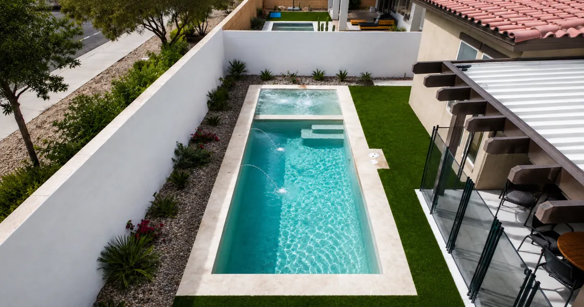 Whitewall — long, slender Optima pool with an attached spa and deck jets in Las Vegas